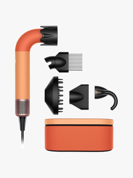 Dyson Supersonic R in Ceramic Apricot in branded components on a light gray background