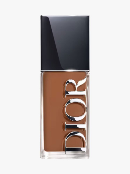 Transparent bottle of Dior Forever Skin Glow Foundation in the shade 7n on light gray background